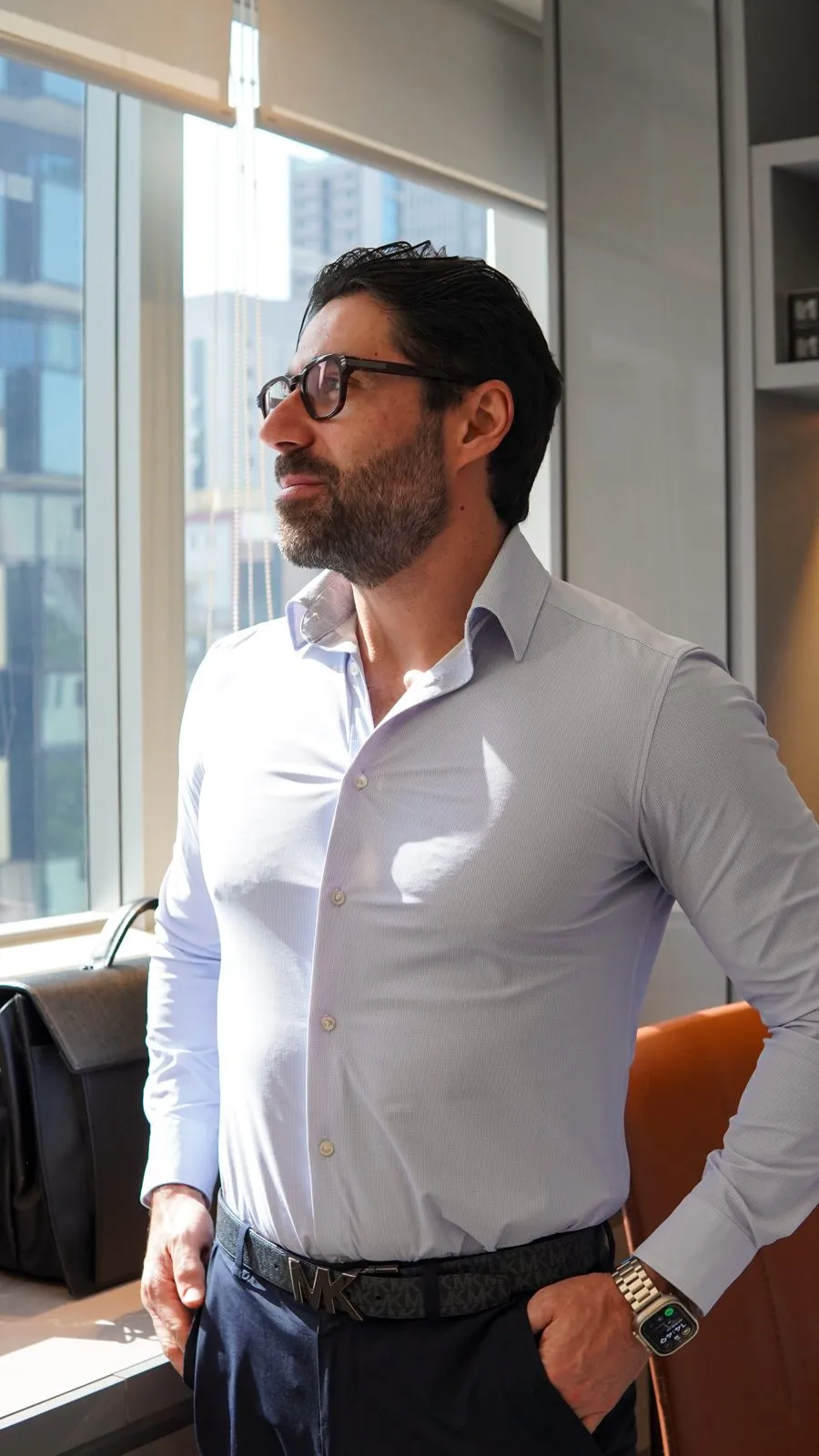 Dr. Roger Vieira in a light shirt, in his office