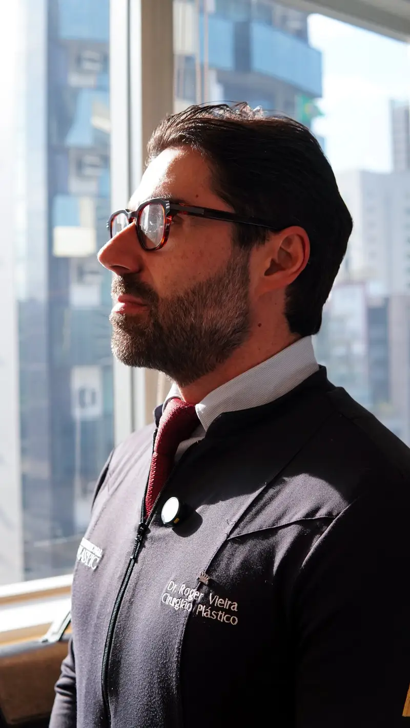 Dr. Roger Vieira looking out the clinic window