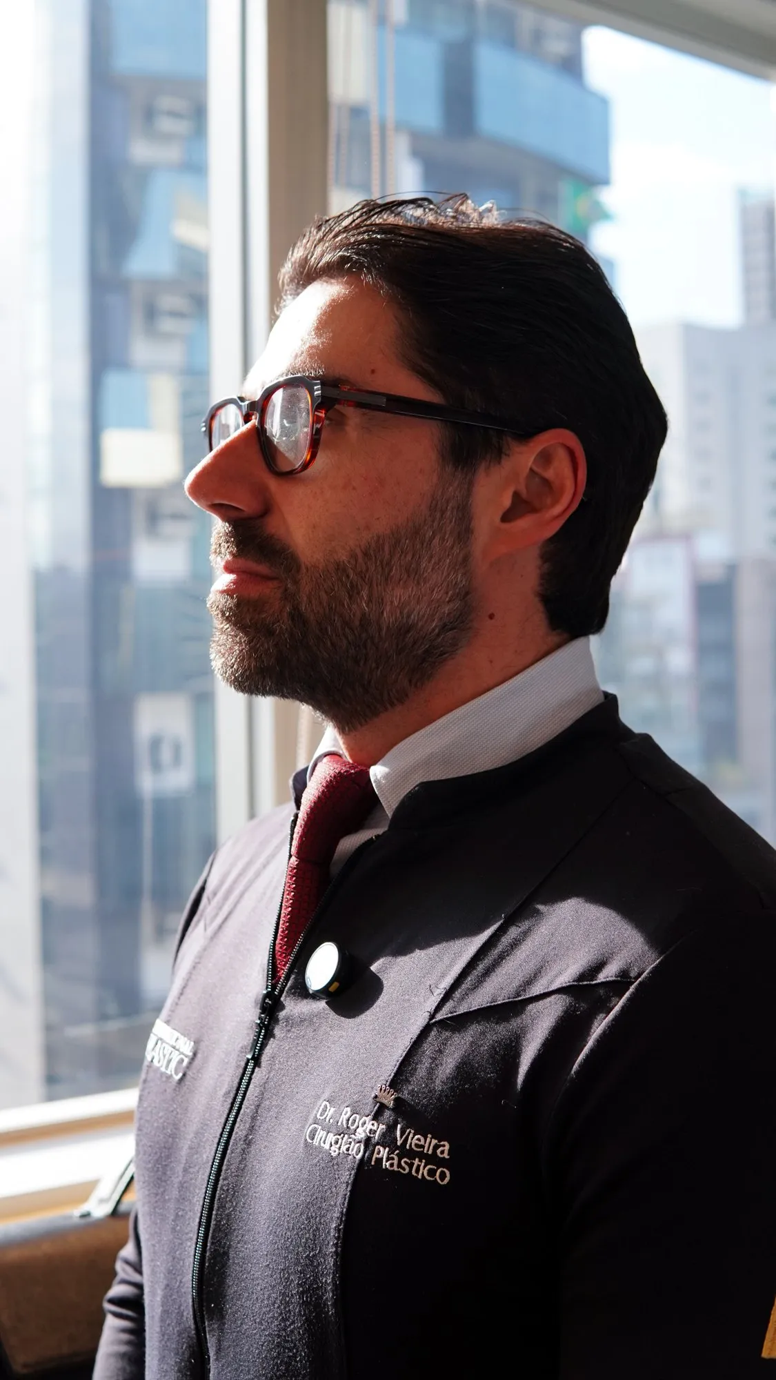 Dr. Roger Vieira looking out the clinic window