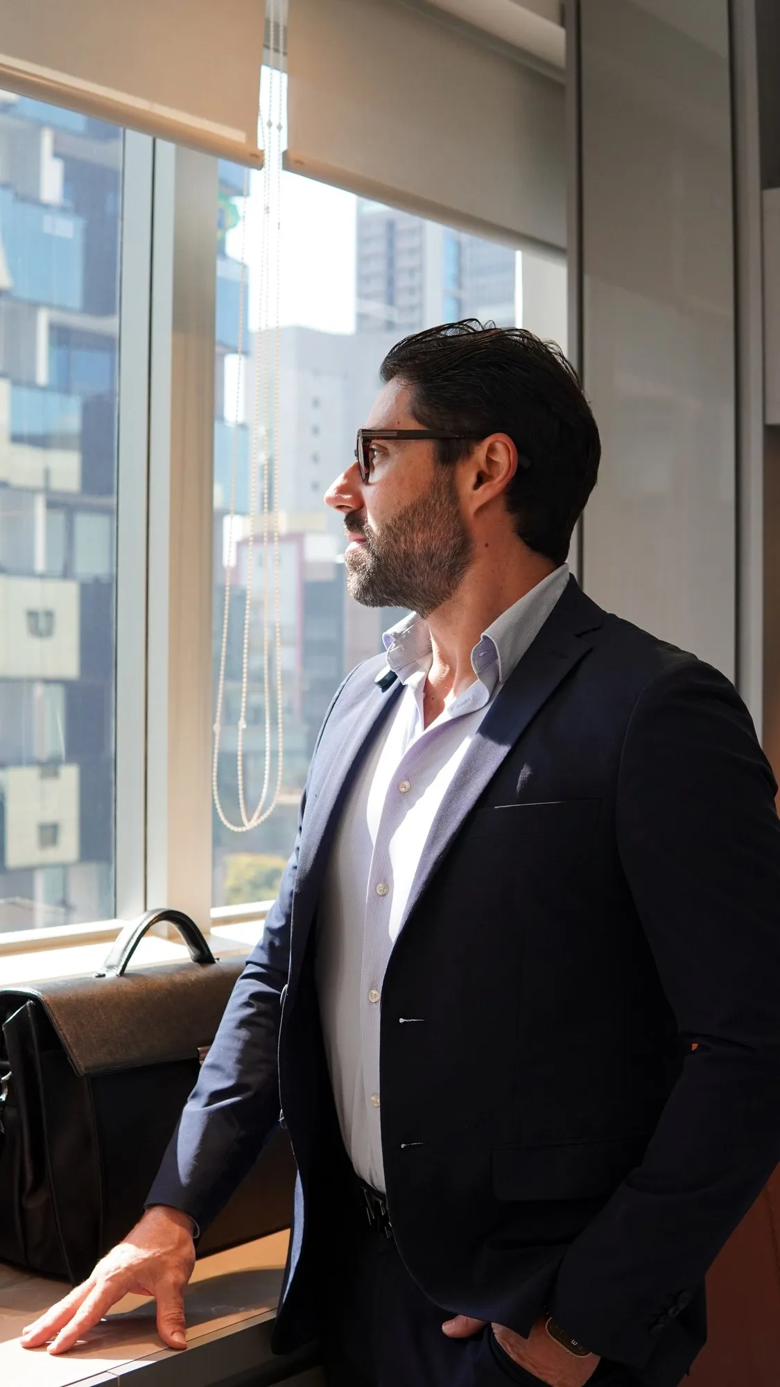 Dr. Roger Vieira in his office, by the window